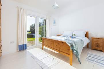 Bedroom 2 has a lovely king size bed and fabulous outlook.
