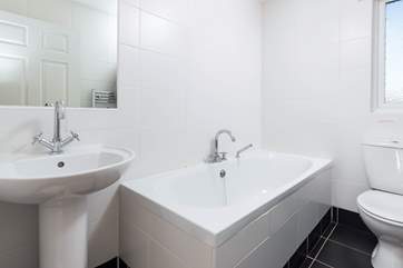 The en-suite has a bath perfect for a soak after a beach day.