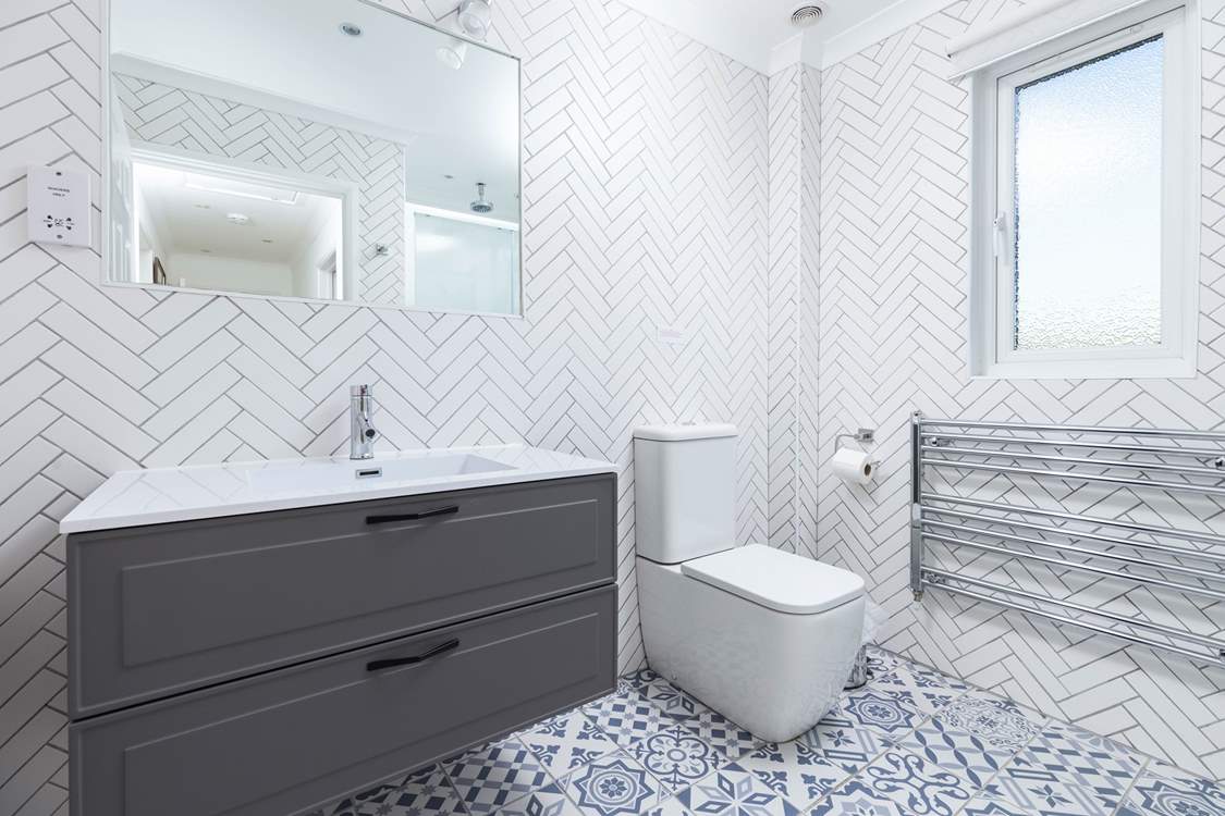 The modern, sleek family shower-room.