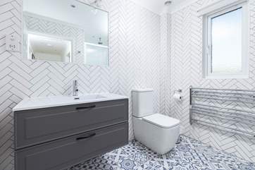 The modern and sleek family shower room.