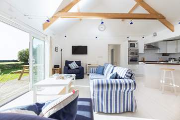 The light floods into the relaxing sitting room.