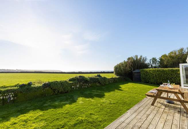 Spectacular views across National Trust fields to the glistening sea beyond, 