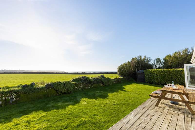 Spectacular views across National Trust fields to the glistening sea beyond, 