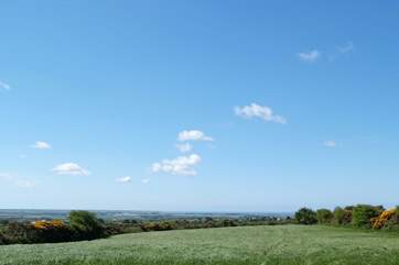 The view from the field next to the garden, with the sea at Mullion Head just visible in the distance.