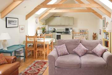 The first floor open plan living-room is light and spacious but also cosy.