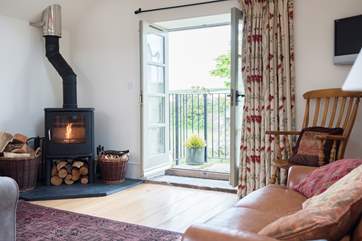 There are French doors at one end of the open plan living-room.