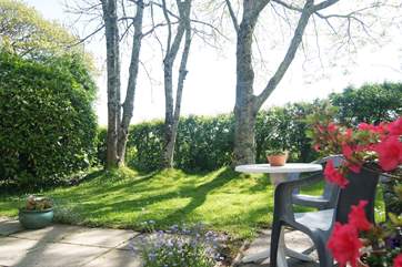 There is a peaceful sitting-area outside the cottage.