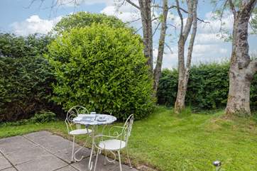 There is a peaceful sitting-area outside the cottage.