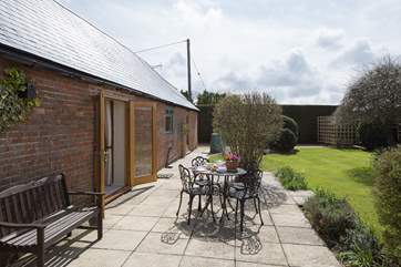 The south-facing garden is the perfect place for al fresco dining, or just relaxing with a good book.