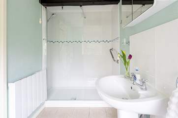 The spacious en suite shower-room has a large walk-in shower.