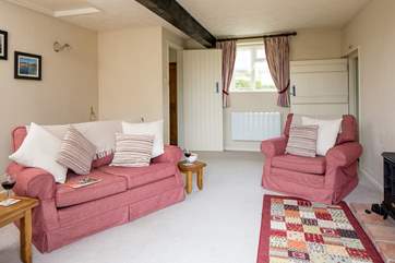 The sitting-room is light and airy.