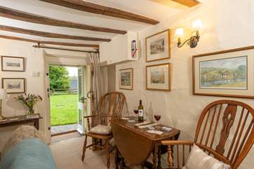 There is an additional dining-table in the sitting-room for cosy suppers with the wood-burning stove lit.