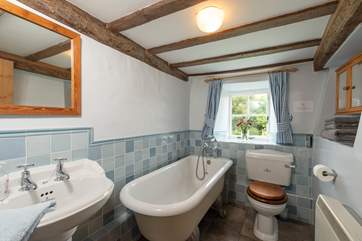 The ground floor bathroom has a lovely roll top bath and a hand held shower.