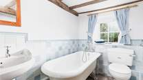 The ground floor bathroom has a lovely roll top bath and a hand held shower. 