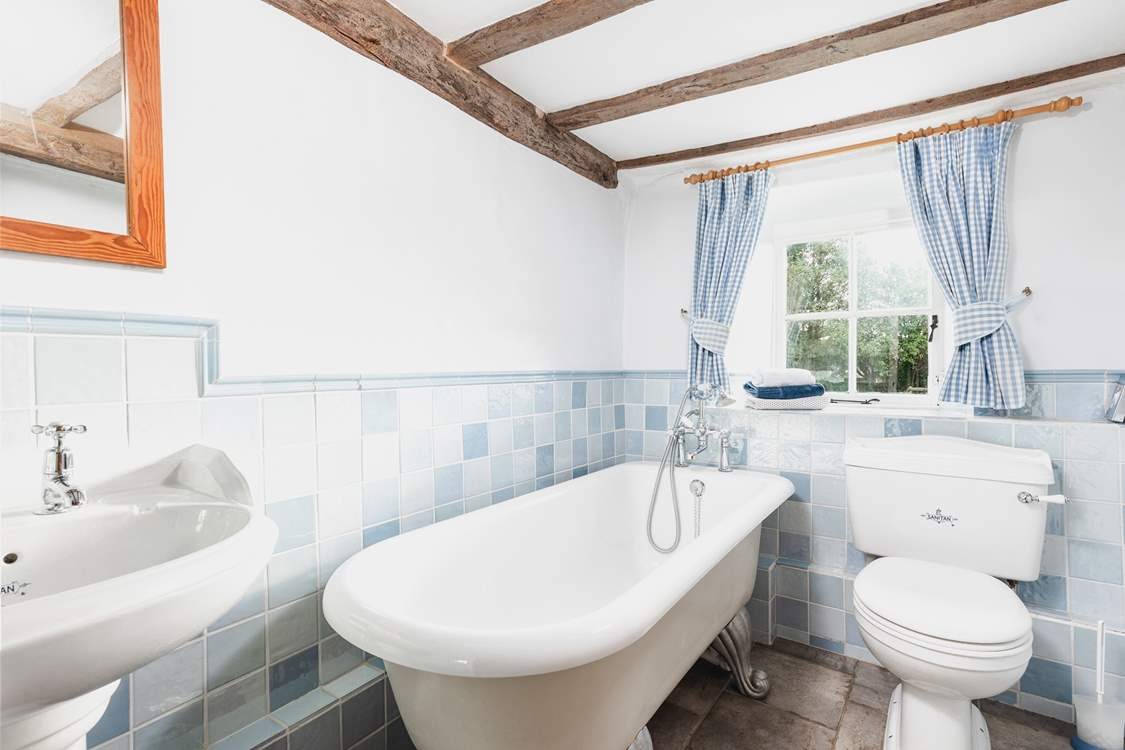 The ground floor bathroom has a lovely roll top bath and a hand held shower.