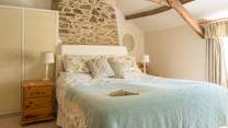 The primary bedroom is quite special. A sumptuous king size bed, stunning views over the garden and packed with original charm and features.