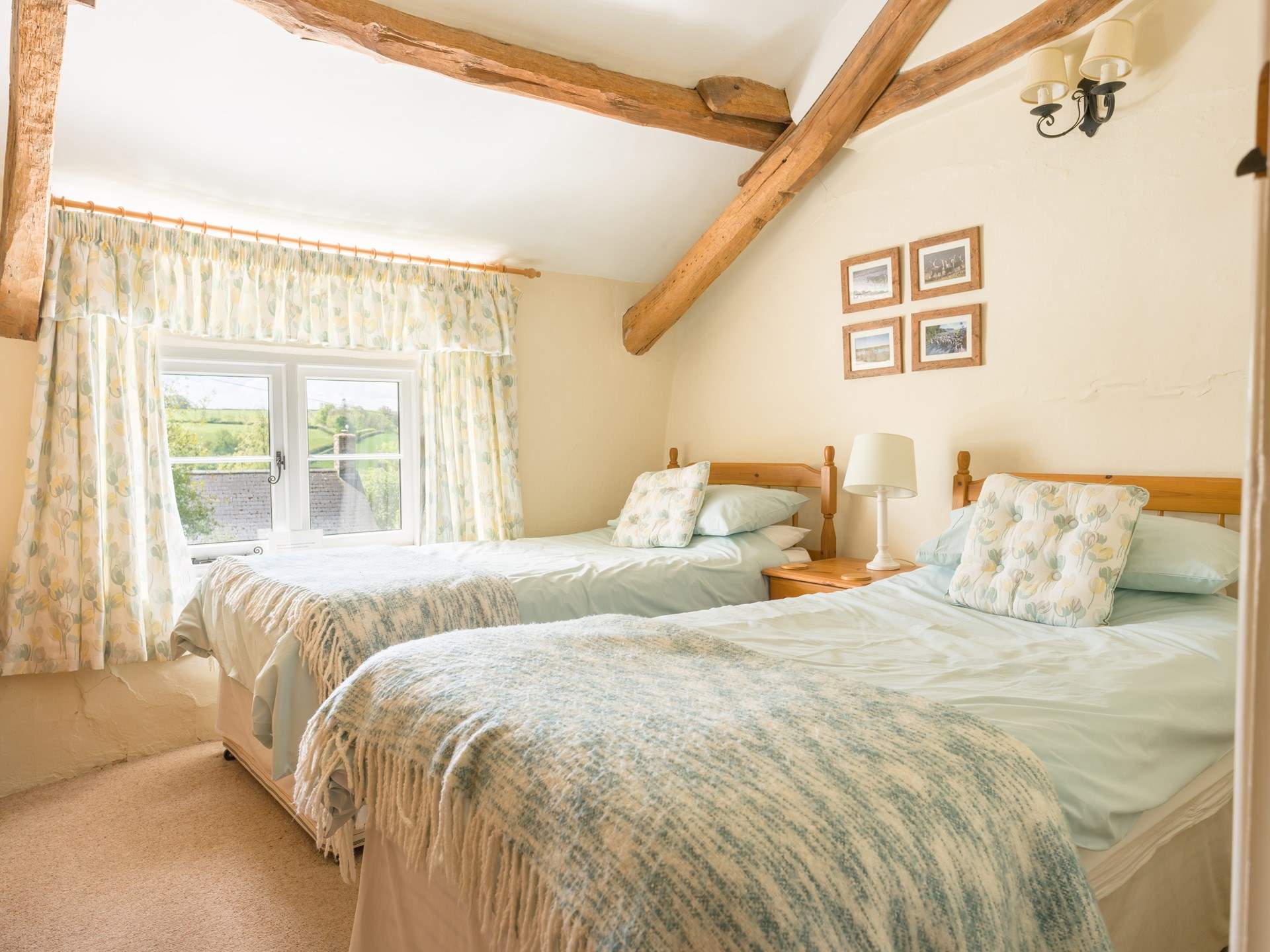 Bedroom is a bright and spacious twin with those amazing views over the garden and beyond.