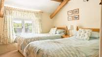 Bedroom is a bright and spacious twin with those amazing views over the garden and beyond.