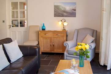 The cottage is very light and welcoming. With the choice of a two seater sofa and comfortable armchair.
