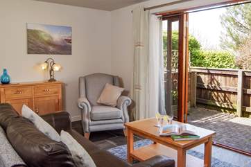 The open plan living, dining, kitchen-area opens onto one of the two outside areas, that are dedicated to Moonstone.