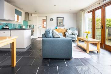 The open plan living, dining, kitchen area opens onto one of the two outside areas that are dedicated to Moonstone.