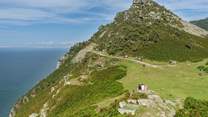 The north coast has wonderful spots to sit with a picnic or you can walk along the coast path for miles and miles and take in the sensational views.