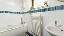 The perfectly formed en suite bathroom, offering the option of both a bath and a shower.