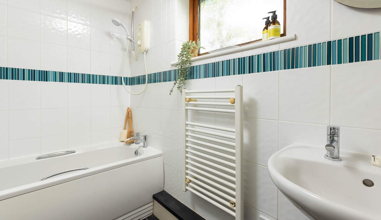 The perfectly formed en suite bathroom, offering the option of both a bath and a shower.