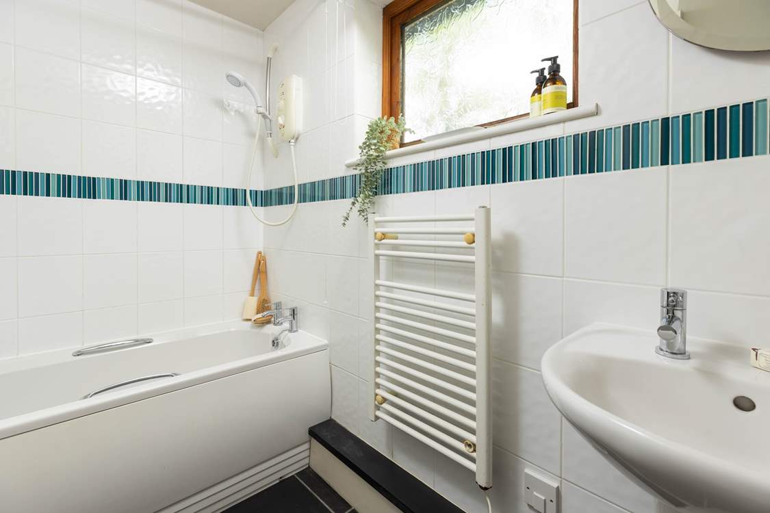 The perfectly formed en suite bathroom, offering the option of both a bath and a shower.
