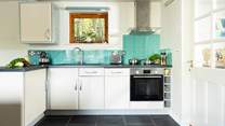 The utility-room and front door are to the right of the open plan living area!