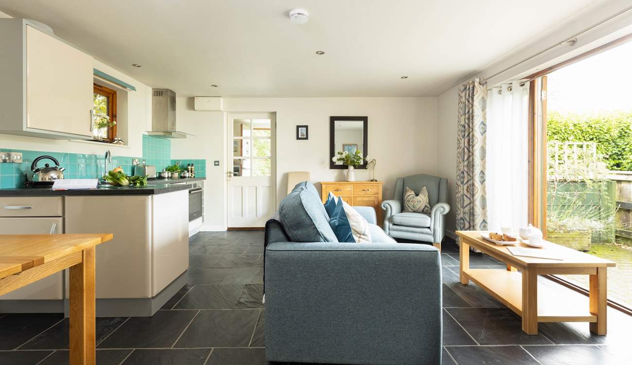 Moonstone awaits your arrival!
The open plan living, dining, kitchen area opens onto one of the two outside areas that are dedicated to Moonstone.