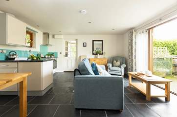 Moonstone awaits your arrival!
The open plan living, dining, kitchen area opens onto one of the two outside areas that are dedicated to Moonstone.
