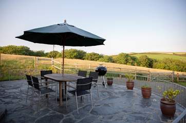 The patio-area boasts stunning countryside views.