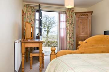 You can enjoy the countryside views from the bedroom.