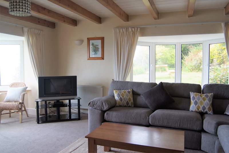 Comfortable and spacious, the large sitting-room has fabulous sea views.
