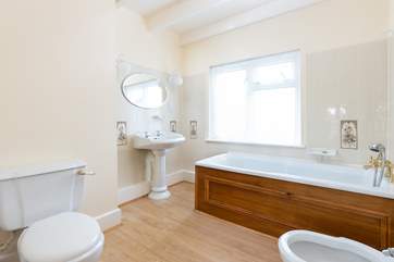 The family bathroom on the first floor has a bath for a long soak after a busy day.