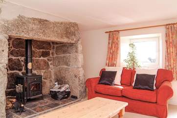 The second sitting-room has a large wood-burner.