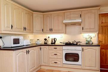The kitchen (the door leads down a couple of steps to the ground floor shower-room).