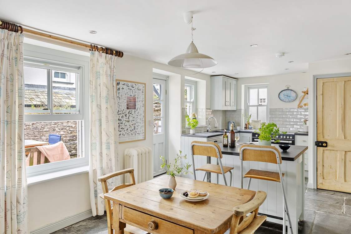 There is easy access from the kitchen out to the terrace and garden.