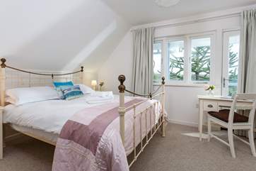 Pretty Bedroom 5 overlooks the front of the property, and is located on the first floor.