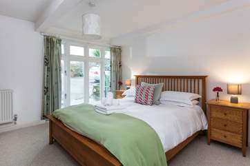 Bedroom 1 has lovely linens and throws.