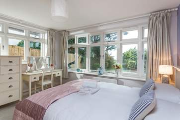 The pretty downstairs double bedroom with en suite.