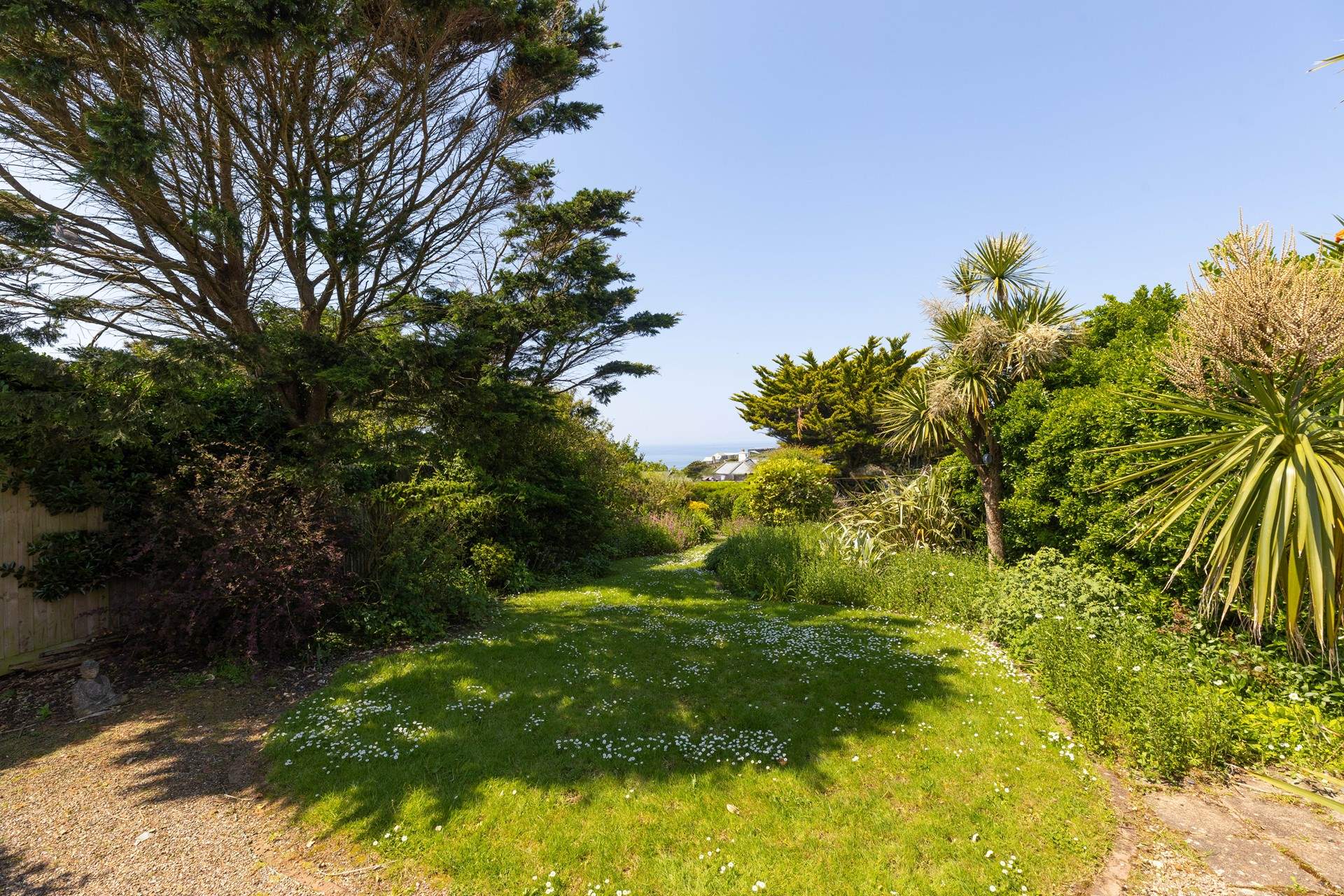 Follow the garden path to the gate which leads you on a path down to the beach.