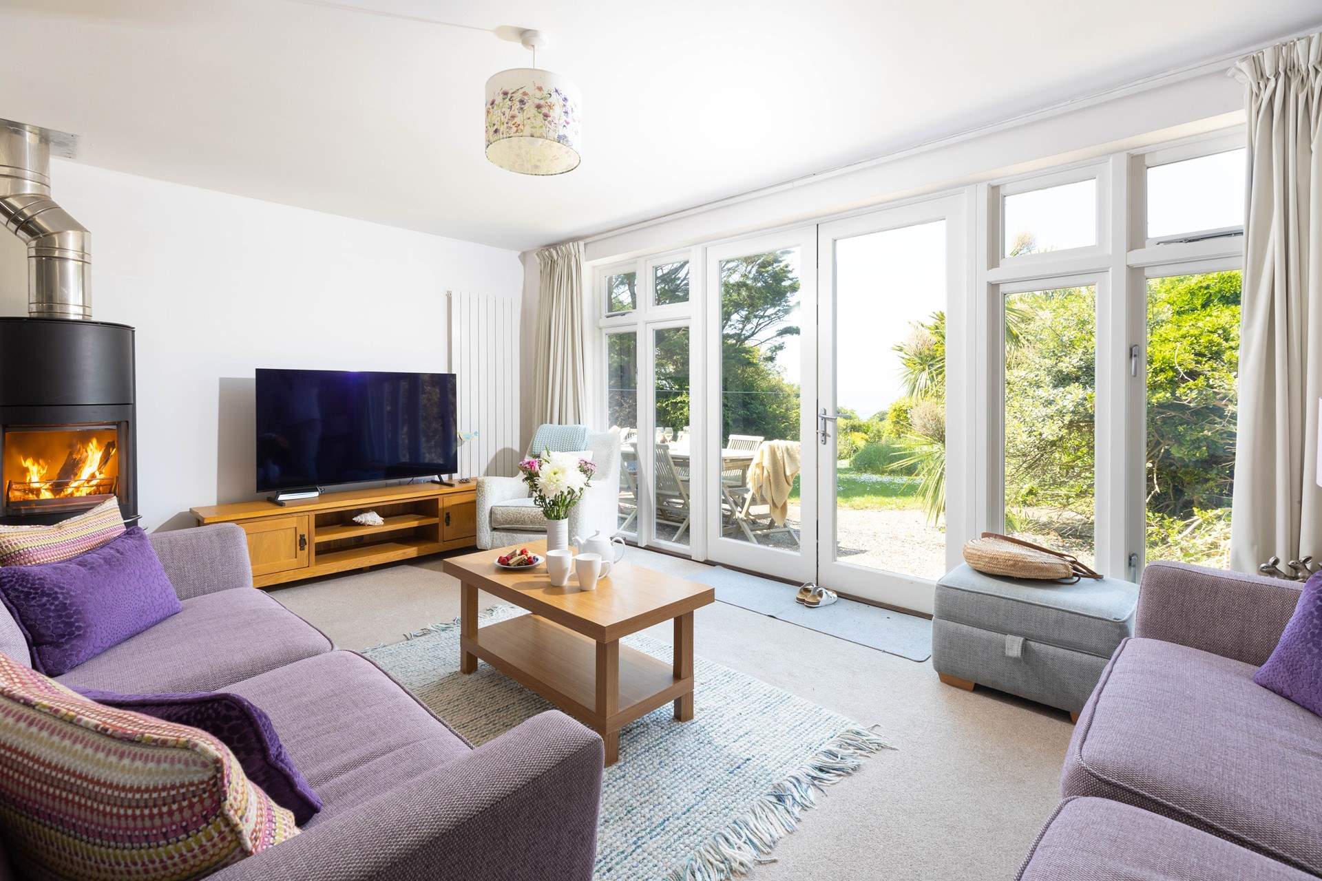 The sitting-area looking out to the enclosed garden with glances of the sea too.