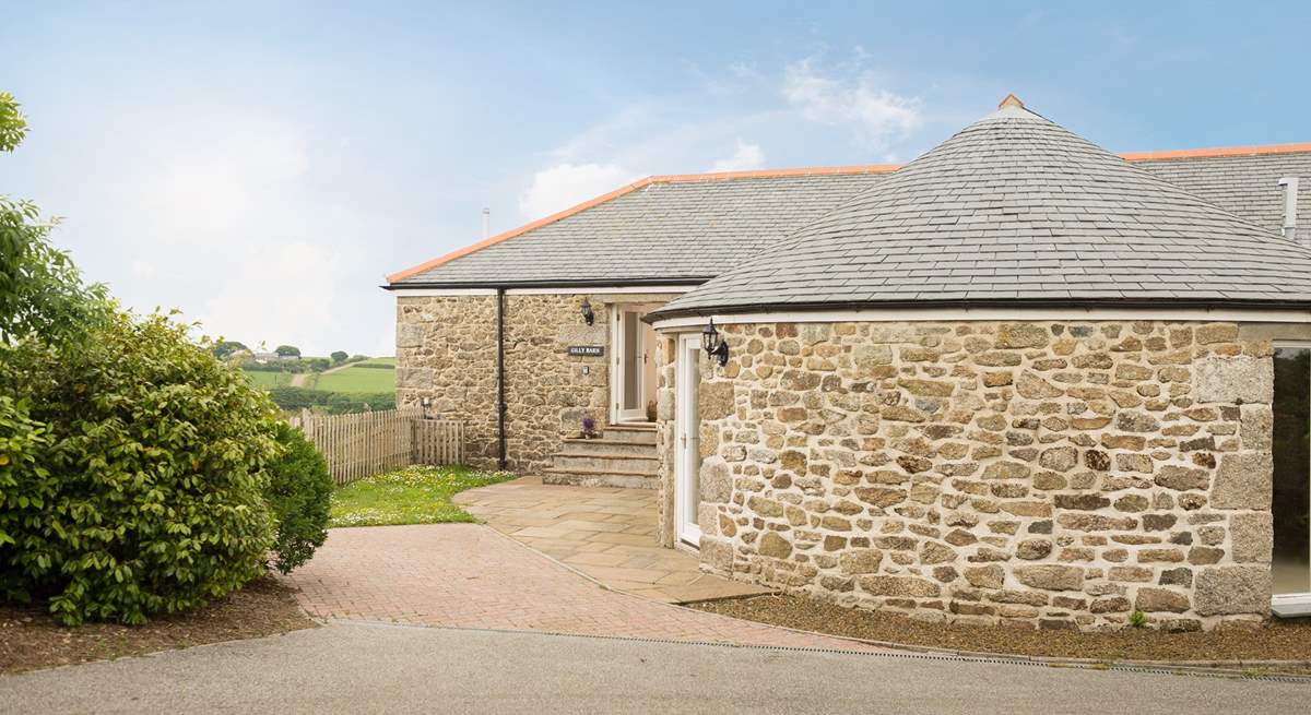 Gilly Barn is a semi-detached converted single barn with living rooms on the ground floor and bedrooms below.