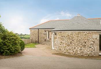 Gilly Barn is a semi-detached converted single barn with living rooms on the ground floor and bedrooms below.