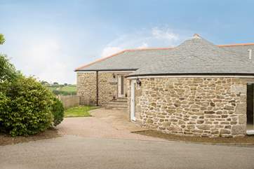 Gilly Barn is a semi-detached converted single barn with living rooms on the ground floor and bedrooms below.