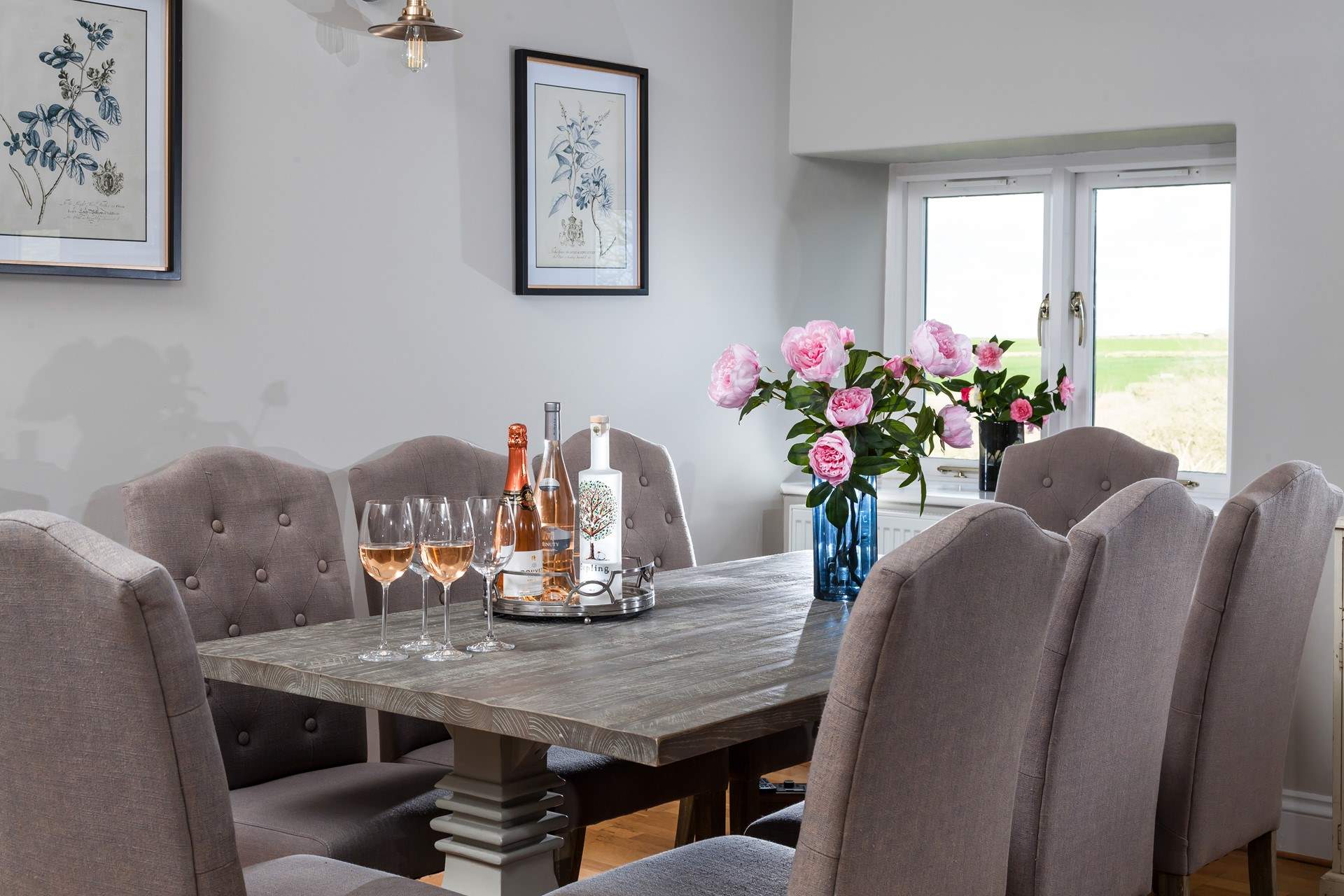The gorgeous dining room overlooks the gardens and fields beyond. 