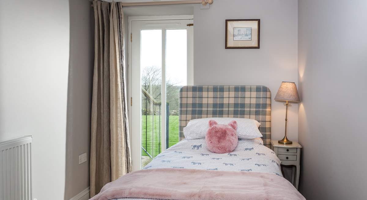 The single bedroom has a door out onto the garden.