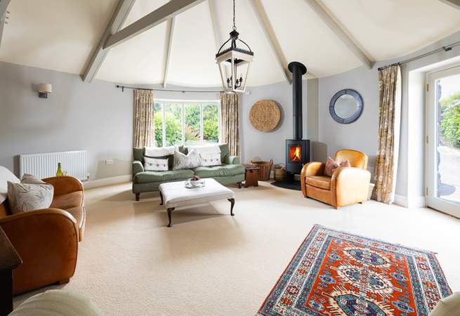 The light and airt sitting room can become super cosy with the curtains drawn and wood burner lit. 